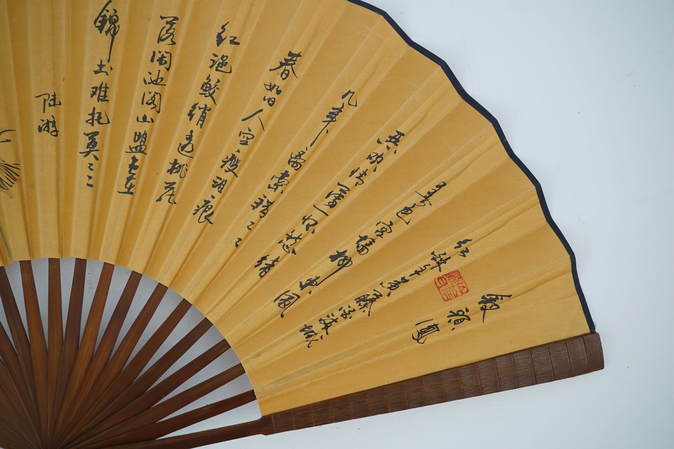 A fine Chinese sandalwood brise fan with finely carved sticks and guards, together with a mid 20th century silk calligraphic poetry LuYou fan, brise fan 38cm wide. Condition - minute damage to carving on one stick, sanda